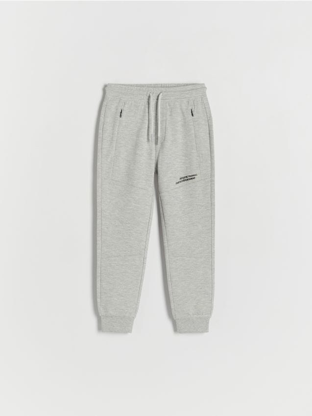 Pantaloni jogger cu detalii tip fermoar - gri deschis Pantaloni jogger cu detalii tip fermoar - gri deschis
