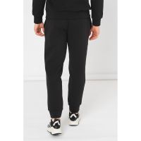Pantaloni sport cu croiala conica si logo