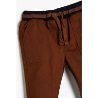 Pantaloni conici cu snur
