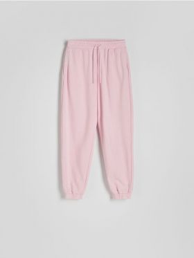 Pantaloni de trening cu efect prespalat - roz-pastel