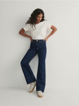 Jeans cu tighele contrastante - bleumarin