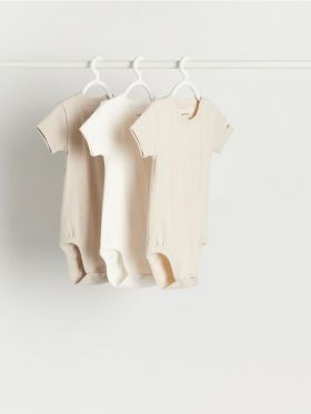 Set de 3 body-uri din material structurat - nude