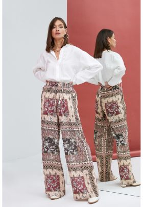 Pantaloni cu croiala ampla si model etnic