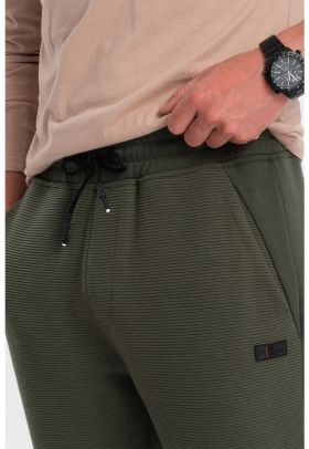 Pantaloni de trening cu croiala conica si snur de ajustare