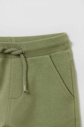 OVS pantaloni de trening din bumbac pentru bebeluși culoarea verde, neted