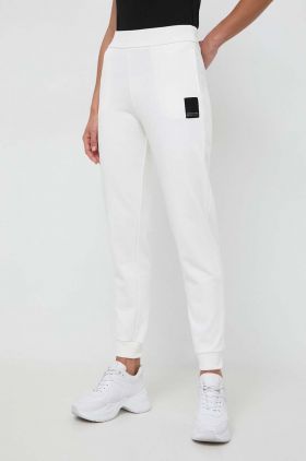 Armani Exchange pantaloni de trening din bumbac culoarea bej, neted