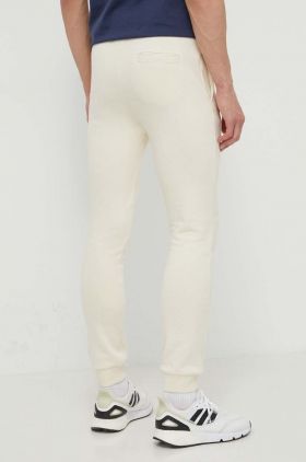 Ellesse pantaloni de trening Ovest Jog Pant culoarea bej, cu imprimeu, SHV01763